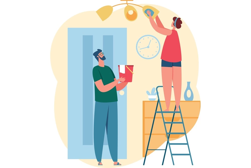 woman on ladder cleaning light fixture and man holding bucket