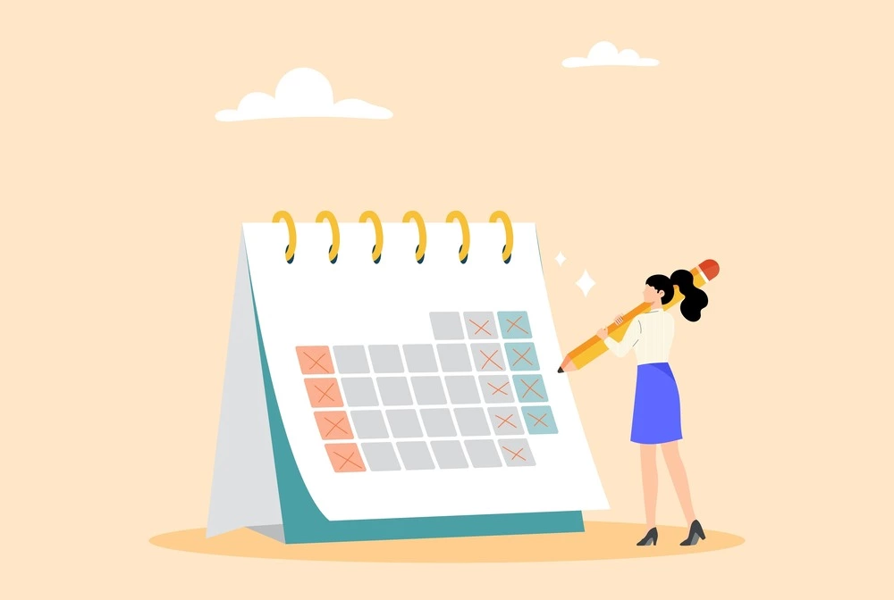 filling out calendar with pencil